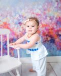 Some of my favorite sessions are the ones where families choose something a little different. 💙✨

This beautiful floral backdrop isn't one of my most requested backgrounds, but every time I use it, I'm reminded just how gorgeous it is! The soft blues, pinks, and purples paired perfectly with this sweet one-year-old and made every photo feel bright, timeless, and full of personality.

One-year sessions are such a fun milestone. They're standing, crawling, exploring, flashing those adorable little smiles, and showing off the personality they've spent the last year growing into. I love getting to capture this stage before they become full-blown toddlers.

Sometimes stepping outside the "popular" choices creates some of the most beautiful memories. I think these turned out absolutely adorable! 💕

#staceyhansenphotography #cachevalleyphotographer #oneyearsession #milestonephotography #utahfamilyphotographer